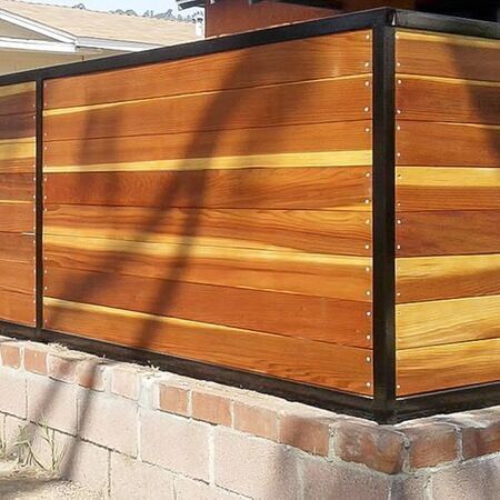 Redwood front yard fence with metal trim